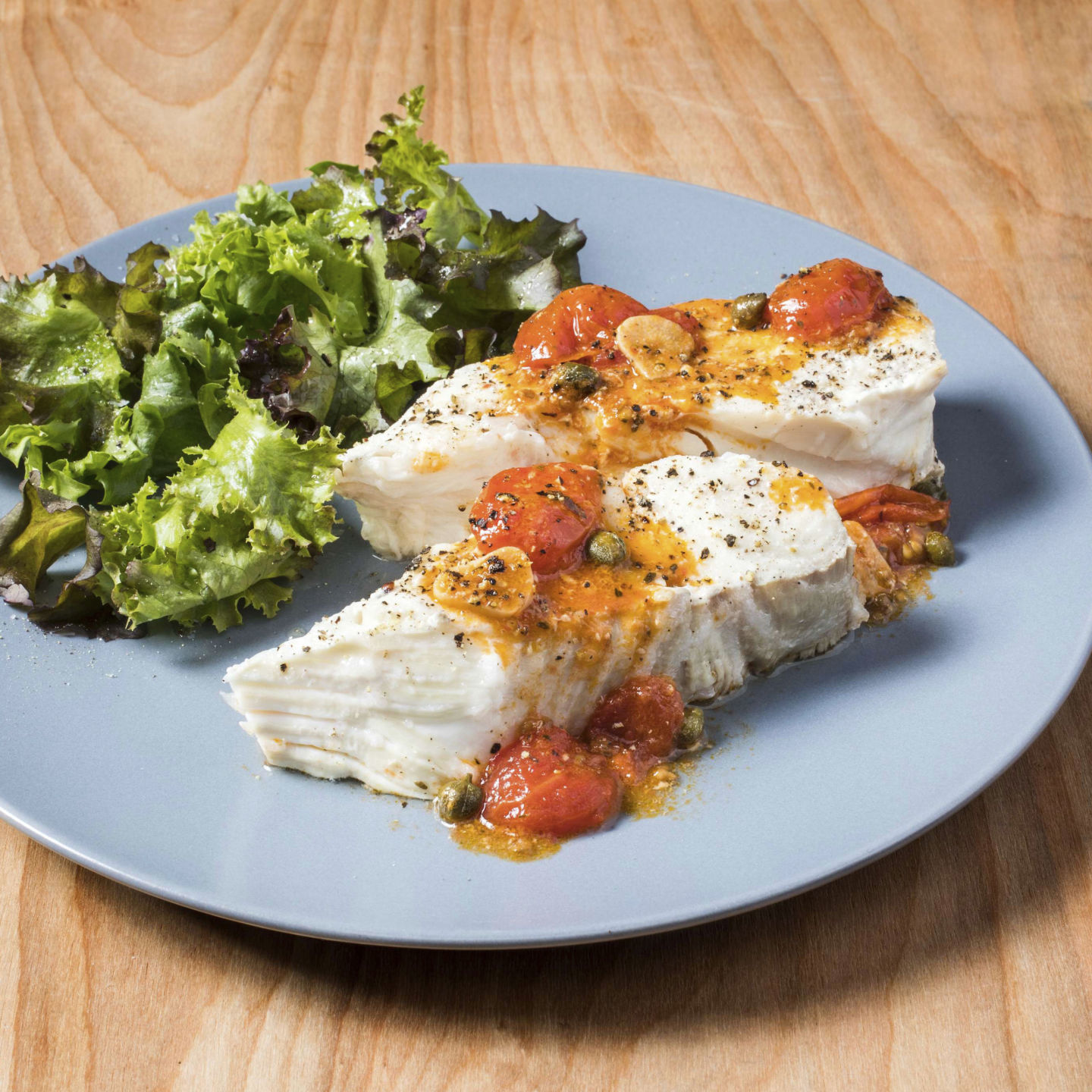 Food Column ATK Halibut with Roasted Garlic and Cherry Tomatoes